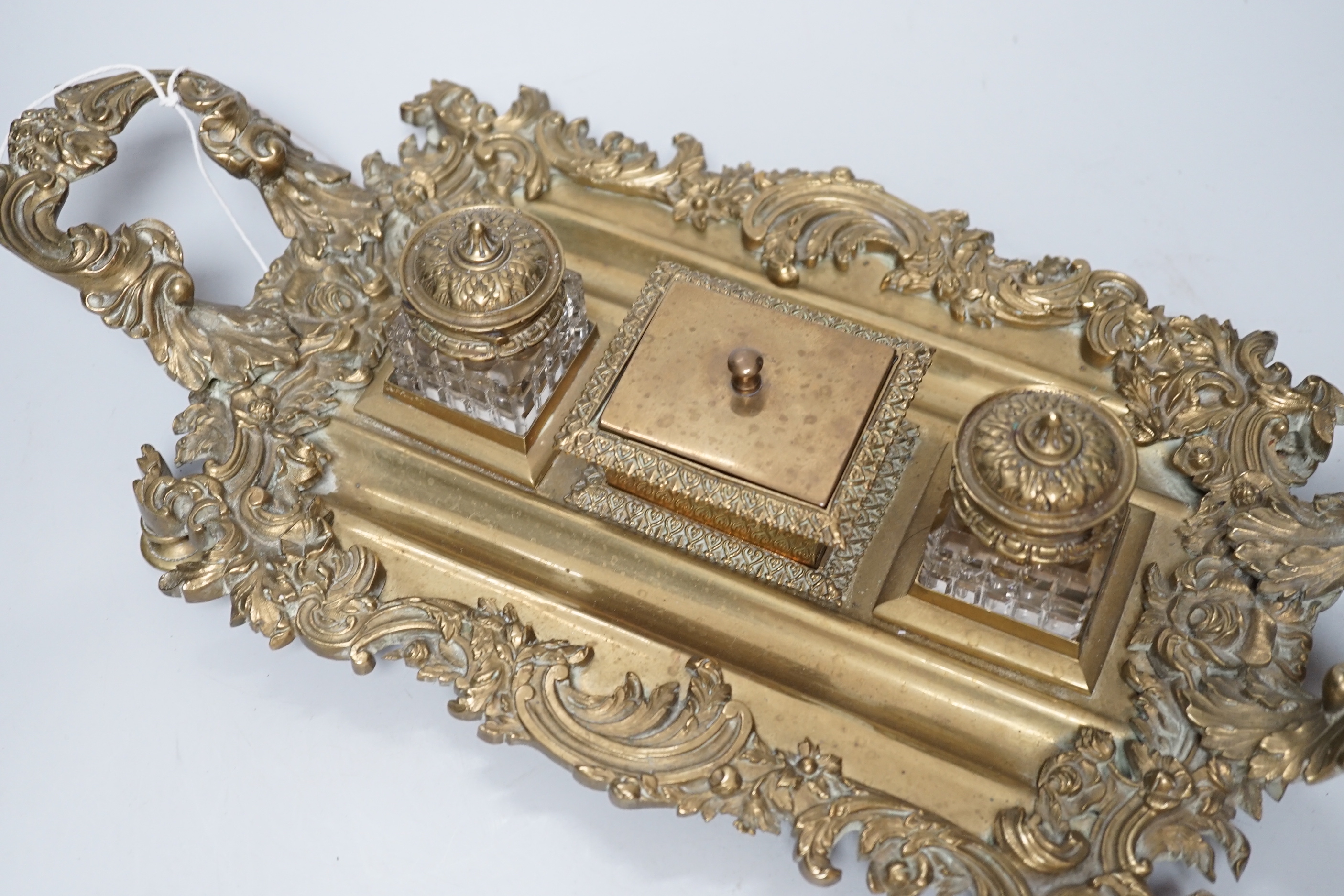 An early 20th century French cast brass desk stand, 45cm long